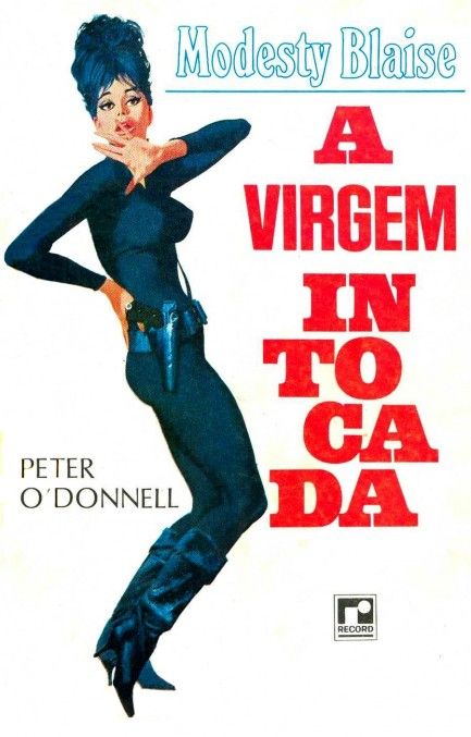 book cover reads "Modesty Blaise A Virgem intocada" (The Impossible Virgin) - blue and red text on white background, to the right of Modesty, woh is seen in profile wearing the same outfit and hairstyle as the previous cover (though her gun on her hip is more visible here). the author's name Peter O'Donnell is written to the left of Modesty near the crooks of her knees. 