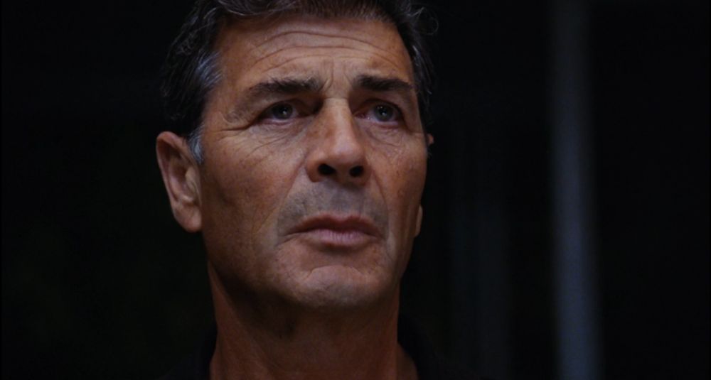 closeup on Forster/Max Cherry's face as he sees Pam Grier's Jackie Brown for the first time 