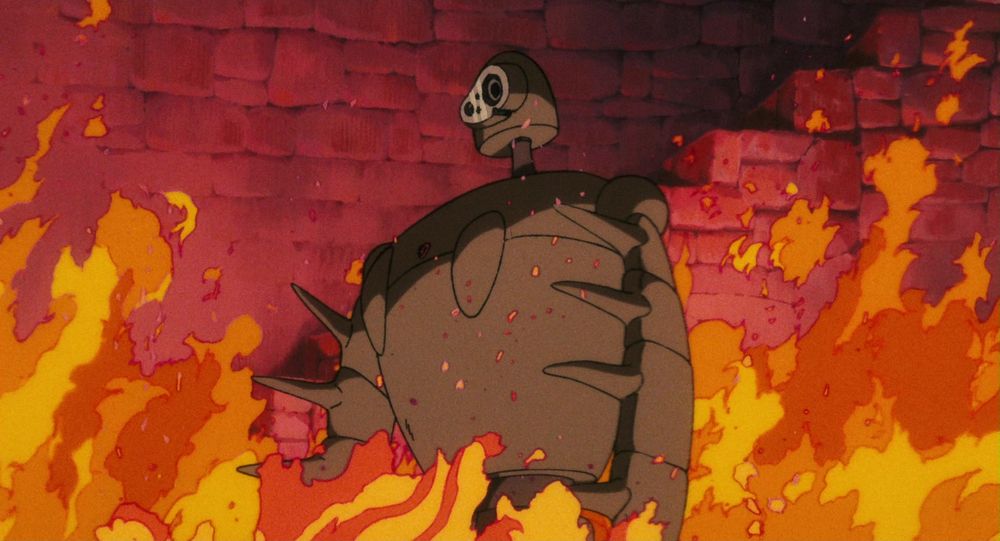 A robot soldier standing amid a blaze in Laputa: Castle in the Sky (1984)