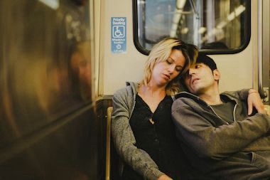still from Animals of a young man and woman embracing on a train