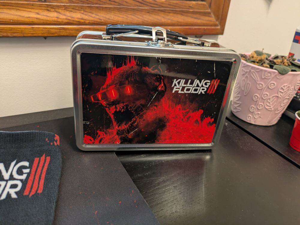 A lunchbox with a Zed head from Killing Floor 3