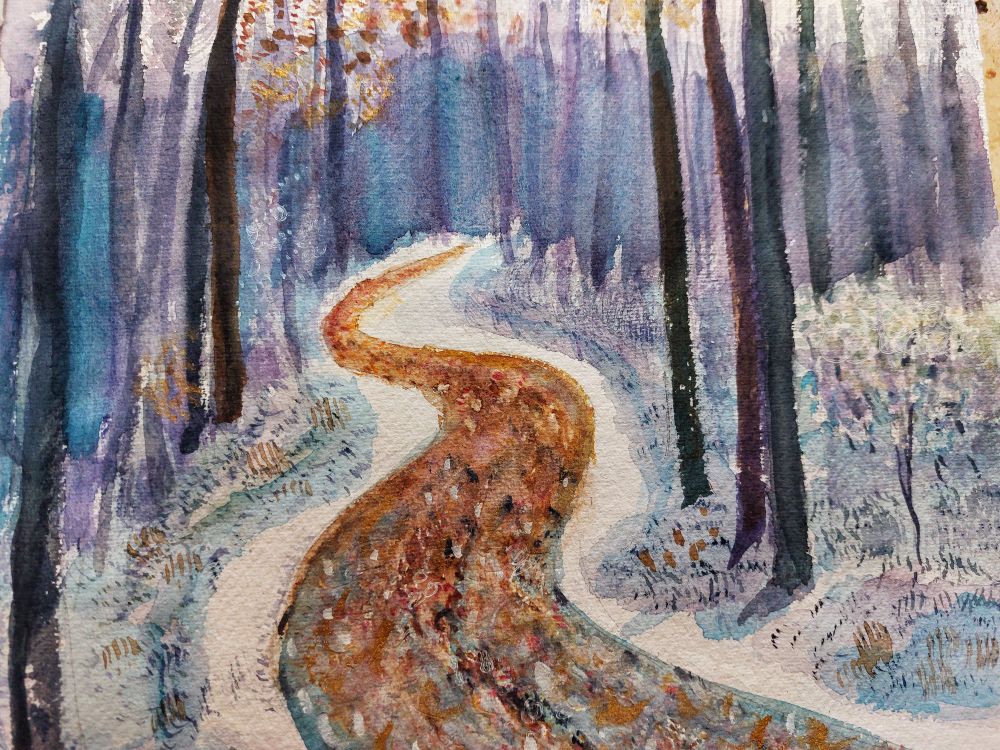 Winding path through snowy woods
