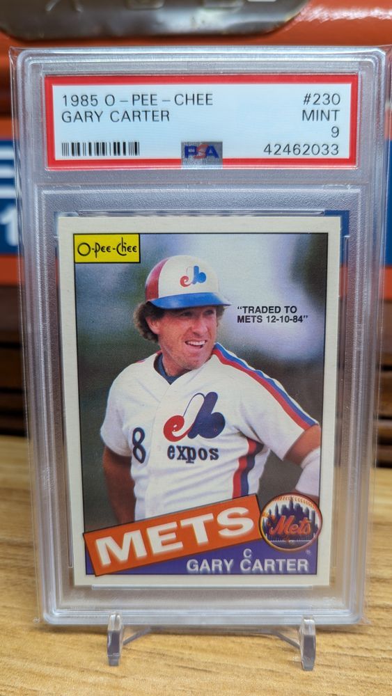 A 1985 O-Pee-Chee baseball card denoting the day the Mets acquired Gary Carter in a trade with Montreal. He's in an Expos jersey but it says Mets
