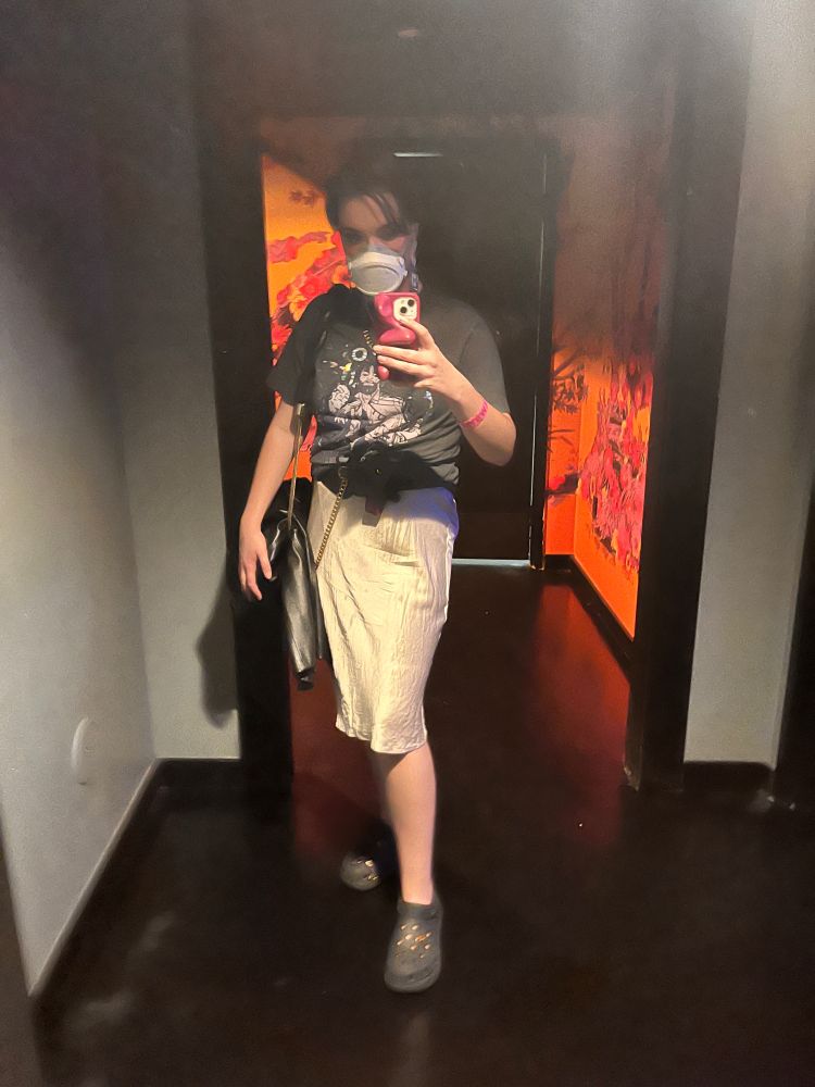 That same person with the mask and the JayVik shirt, but make it mirror selfie