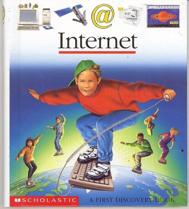 Cover of old scholastic book called Internet with child surfing on keyboard above the earth.