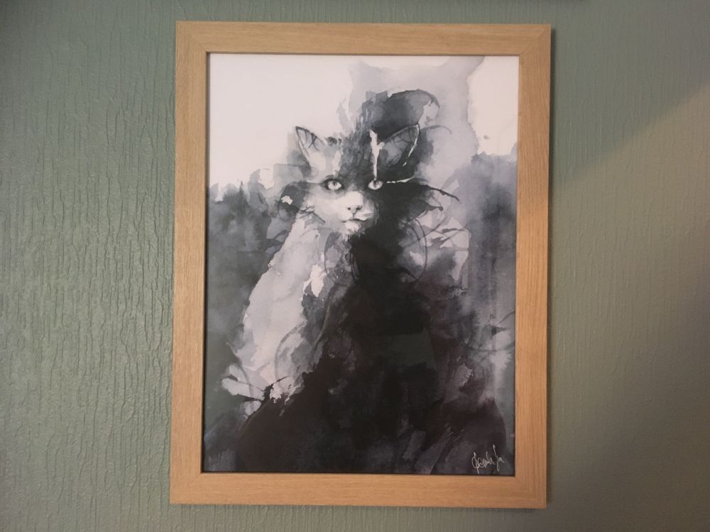 A Daniele Serra print of a blue cat originally done in his watercolor style. 