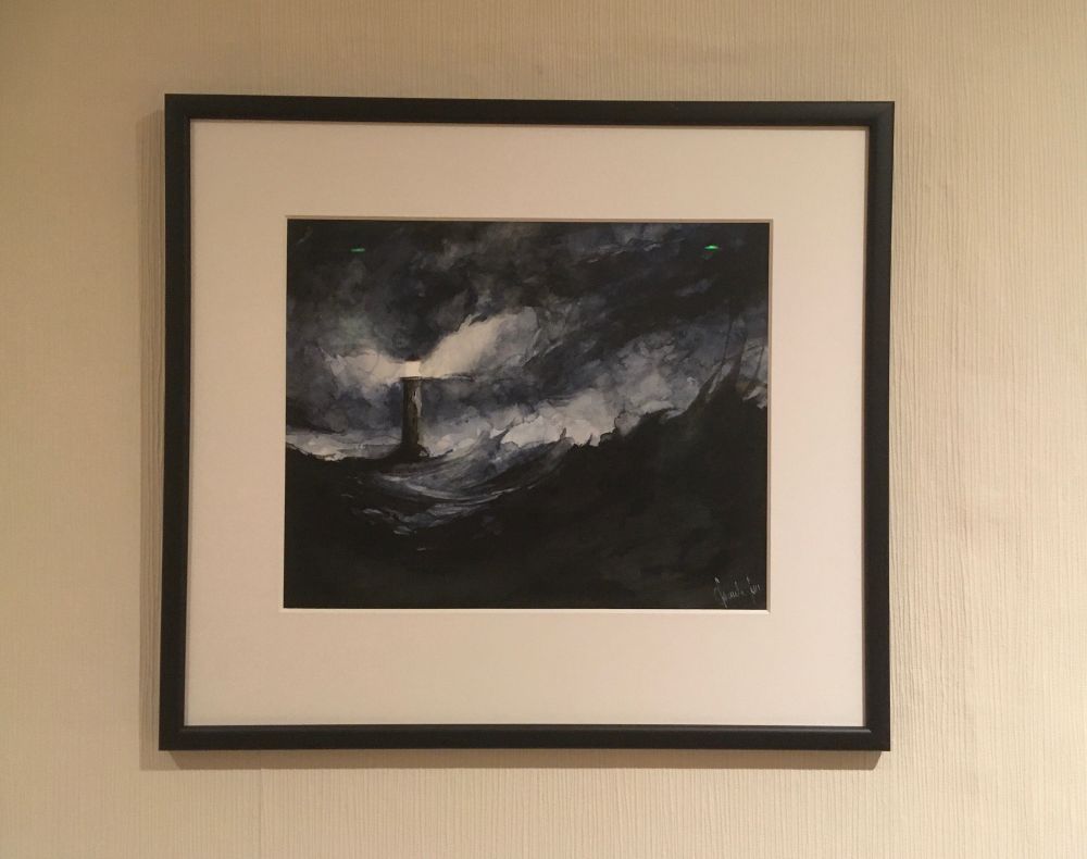 “Lighthouse”: An original watercolor by Daniele Serra. Done mainly in tones of black and dark blue, it shows a lighthouse in stormy weather and choppy waters