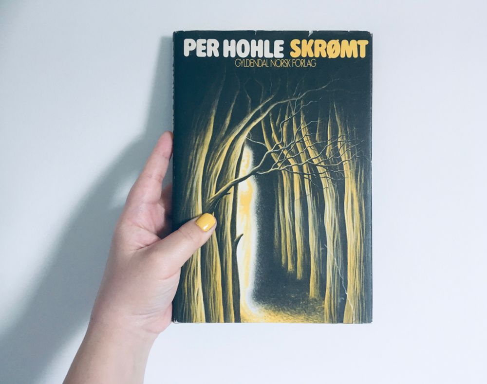 My copy of Skrømt by Per Hohle which offers testimonies from people who’ve experienced the supernatural in central/eastern Norway. No narration for atmosphere’s sake. 
The cover shows a glowing spectral being emerging from the dark woods 