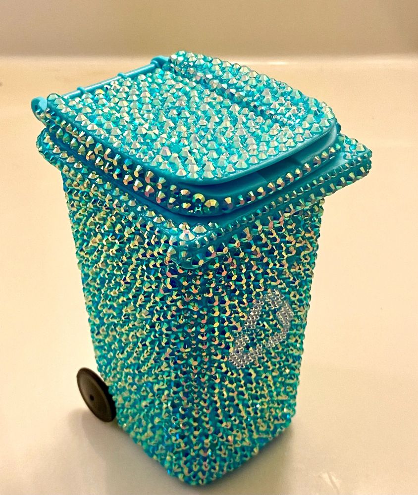A mini-bedazzled recycling bin
