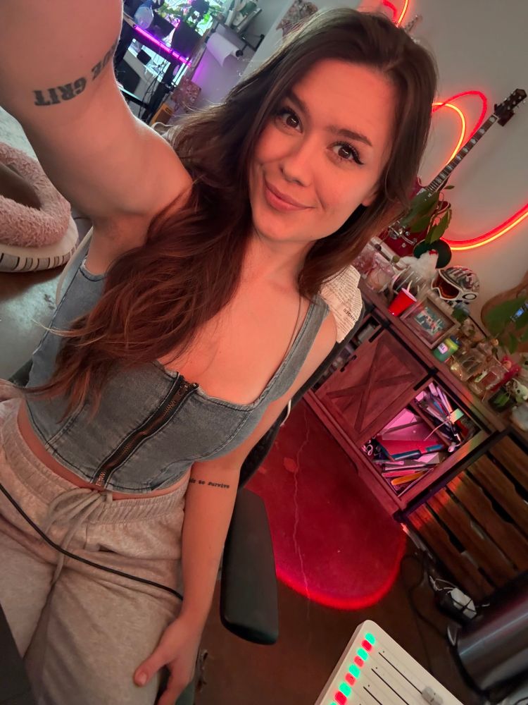 Selfie of me at my desk with my long brown hair 