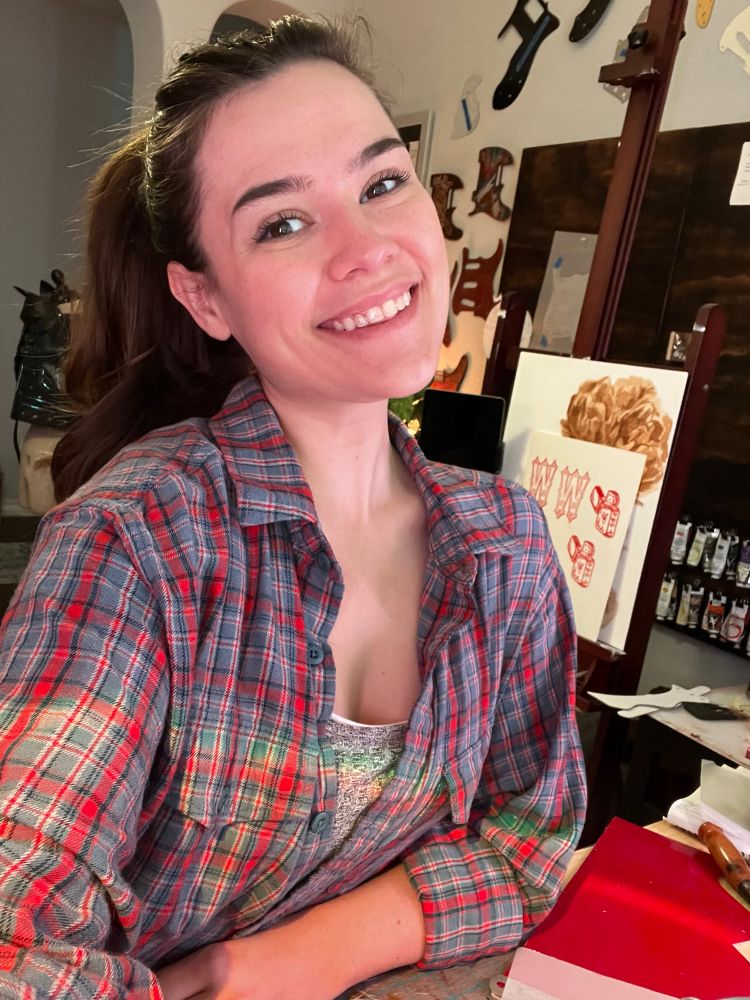 Selfie of me at my workbench wearing a plaid 