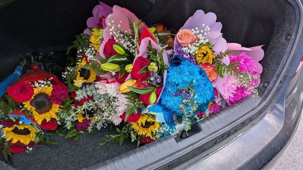 A pile of bouquets sitting in my trunk
