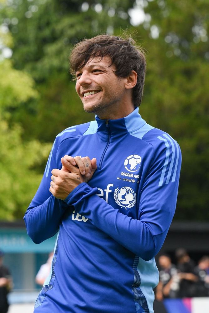 Louis Tomlinson smiling during Soccer Aid 2025 training 