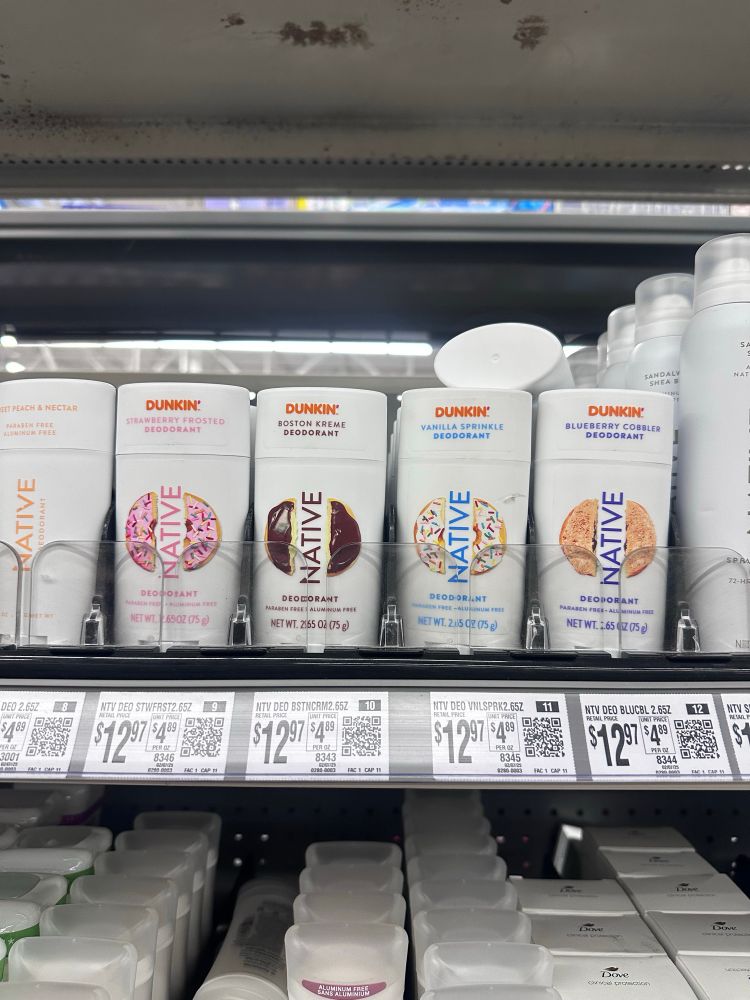 Deodorant on a shelf in a store that is a scent collaboration between Native and Dunkin Donuts