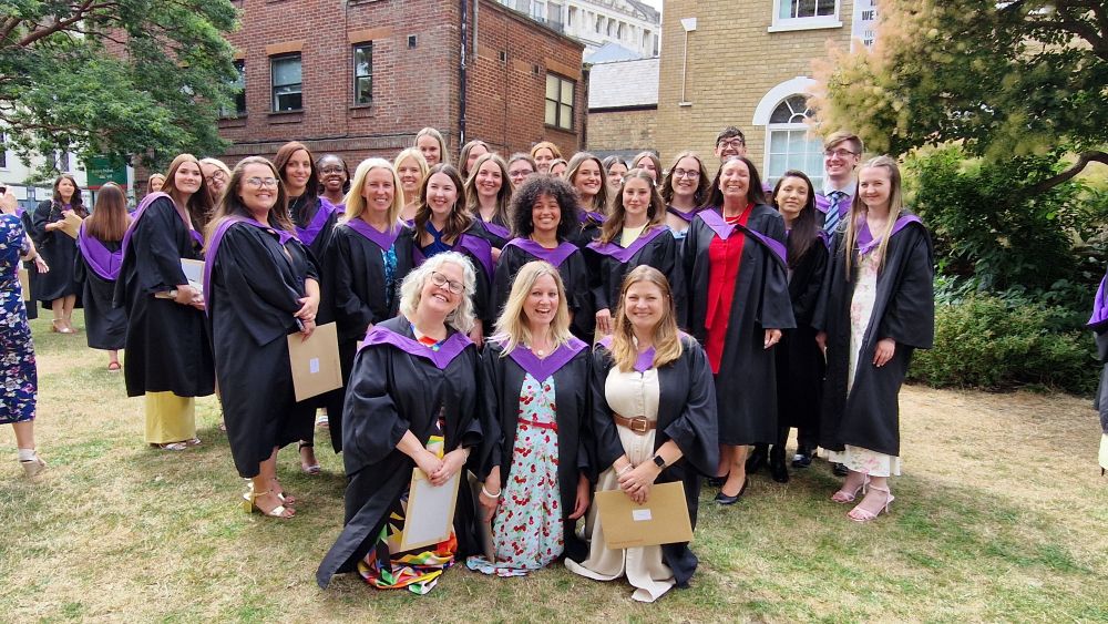 smiley happy teaching graduates.