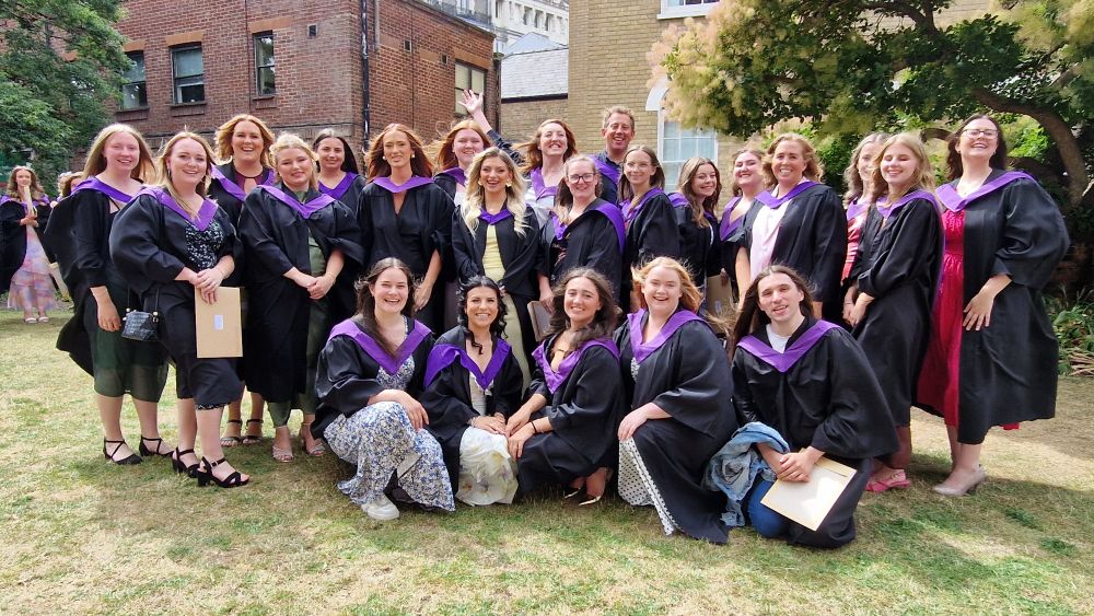 smiley happy teaching graduates.