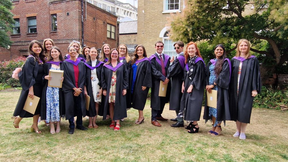smiley happy teaching graduates.