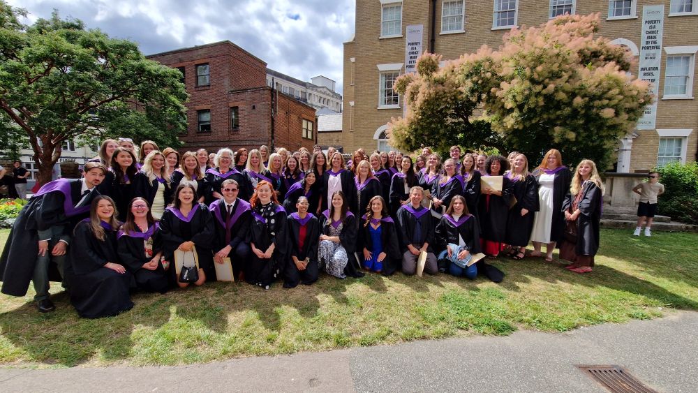smiley happy teaching graduates.