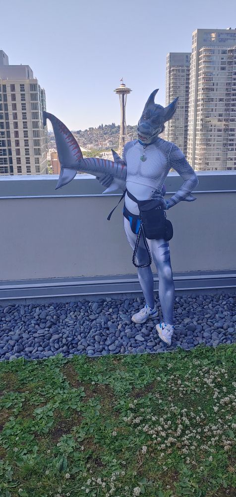 Shark on da rooftop with space needle in the background 