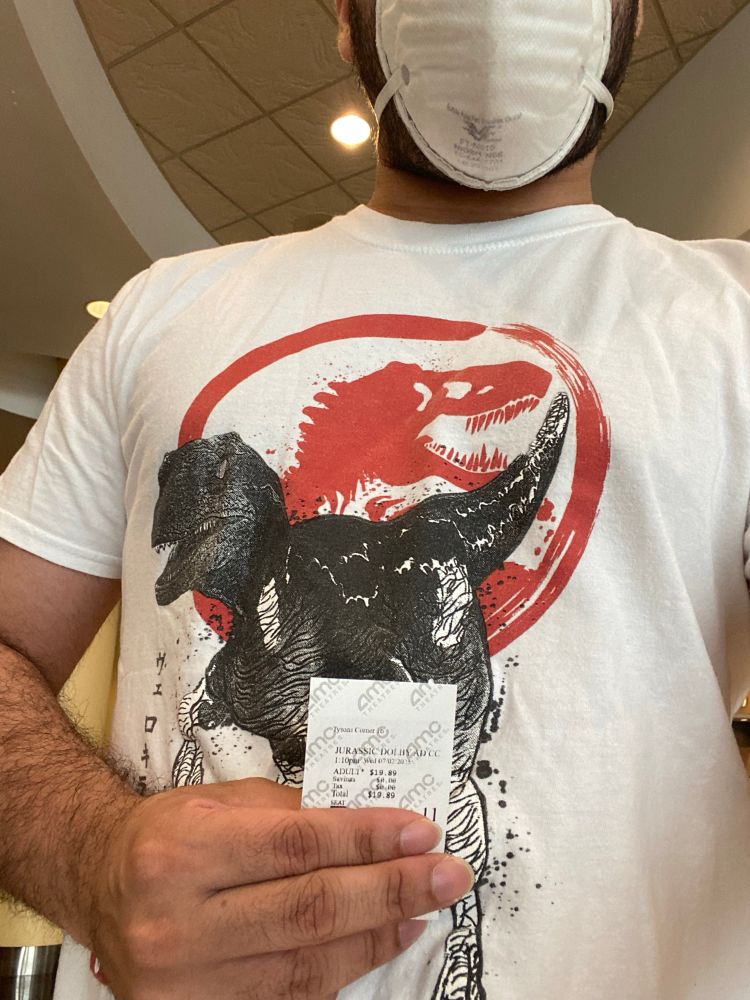 Me wearing a raptor shirt and holding my movie ticket for Jurassic World: Rebirth 