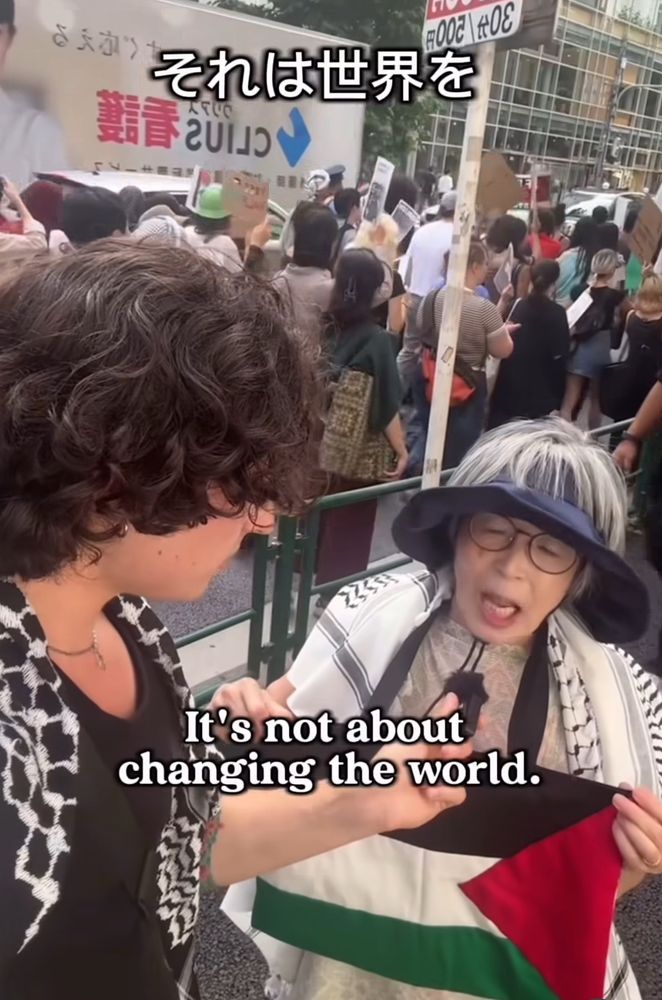 the woman responds in Japanese, with captions: “it’s not about changing the world”

おばあさんは返事しています、「世界を変える事ではなくて」