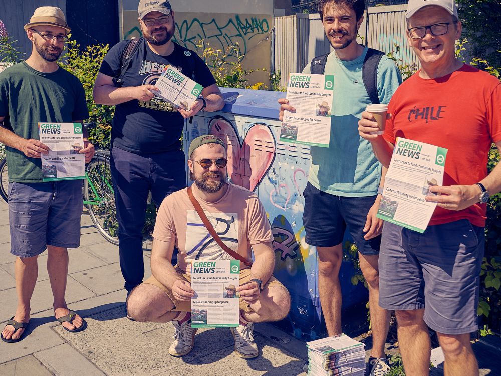 5 chipper North Edinburgh and Leith activists with the latest edition of their local Green News. Several in shorts as it's the hottest day of the year so far.