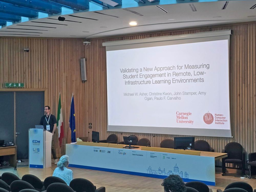Michael Asher presenting "Validating a New Approach for Measuring Student Engagement in Remote, Resource-Limited Learning Environments" which received a best paper award at Learning@Scale 2025