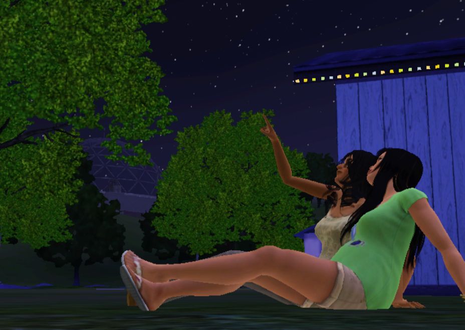 Screenshot of the sims 3 of two sims stargazing 