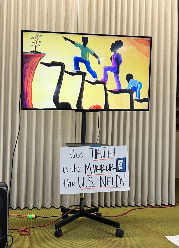 Picture with 3 Black children climbing a staircase toward a plant symbolizing freedom and life