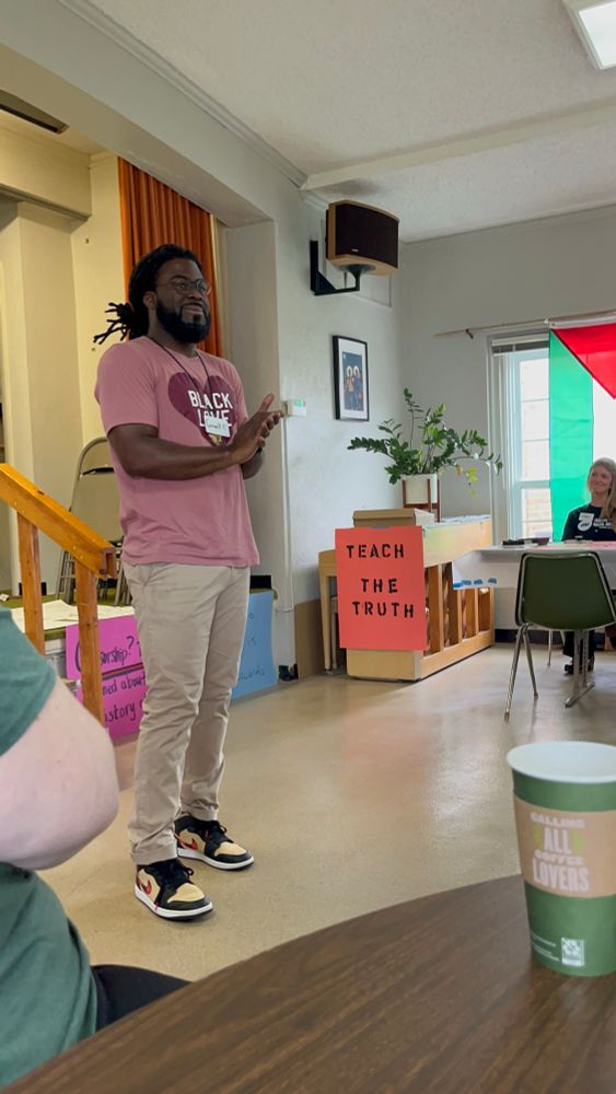 Speaker wearing a shirt that says Black Love