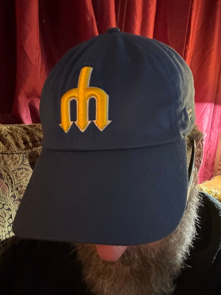 Just a dude wearing his lucky Mariners hat. 