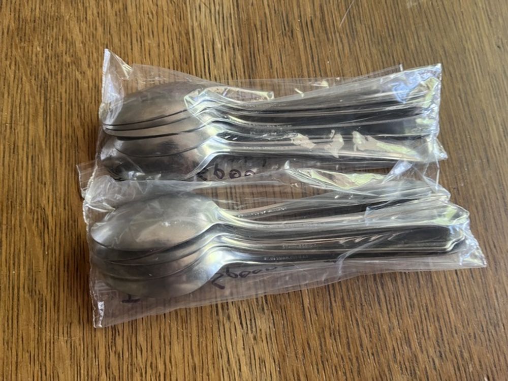 A dozen or so teaspoons in plastic bags.