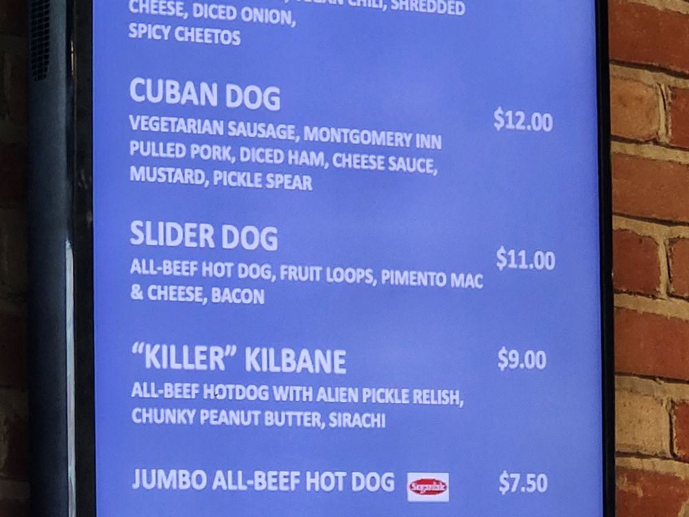 Menu for a hot dog vendor focused on item named Slider Dog: All-beef hot dog, fruit loops, pimento Mac & cheese, bacon