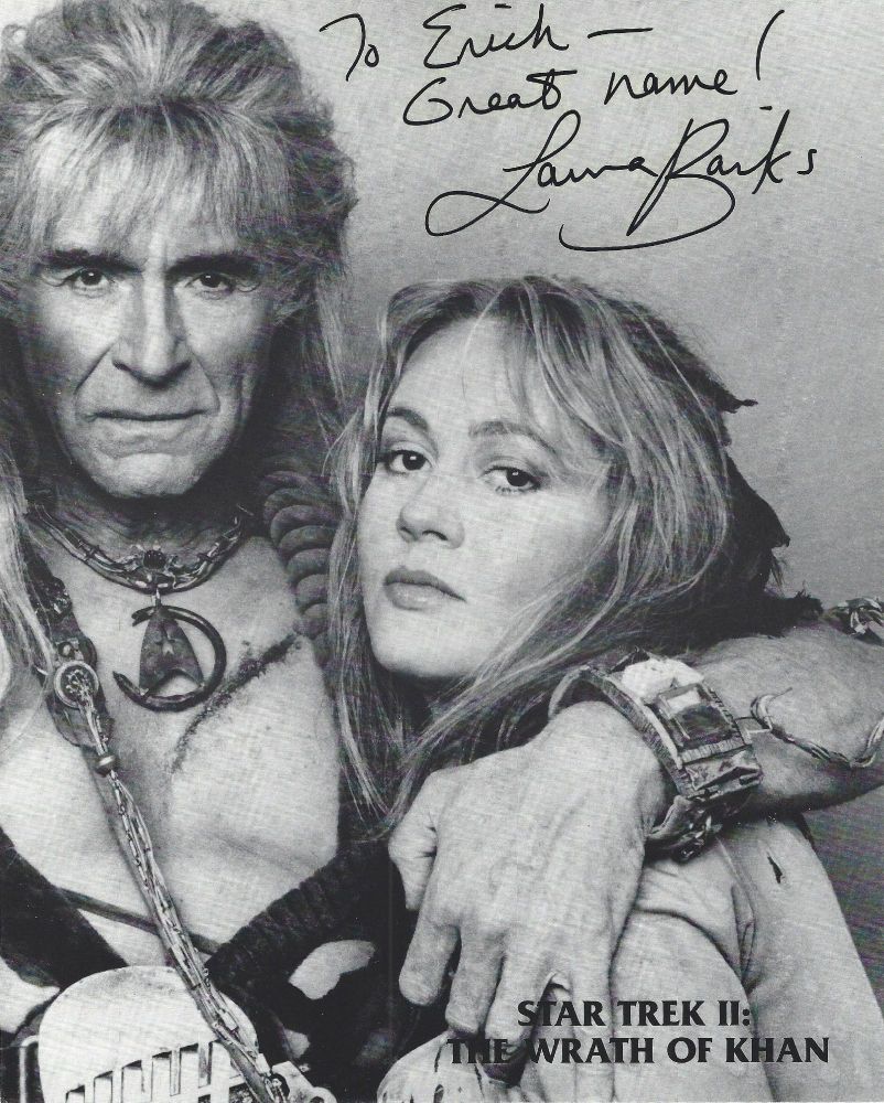 A black-and-white publicity photo from "Star Trek: The Wrath of Khan," featuring Khan (Ricardo Montalban) with his arm around the shoulder of his navigator (Laura Banks). The photo is autographed by Banks, with the inscription reading "To Erich -- Great name! Laura Banks."