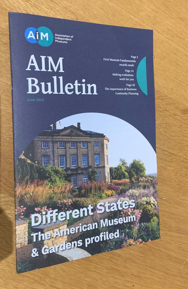 Colour photograph of the front cover of June 2025's AIM Bulletin. The magazine cover includes an image of the American Museum in Bath (a large Georgian country house and garden) with the headline 'Different States - The American Museum & Gardens profiled'