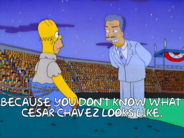 Homer Simpson seeing the ghost of Cesar Chavez as Cesar Romero. 
