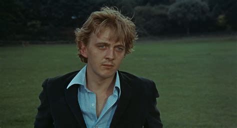 Heavy-lidded David Hemmings in a park (from Blow-Up)
