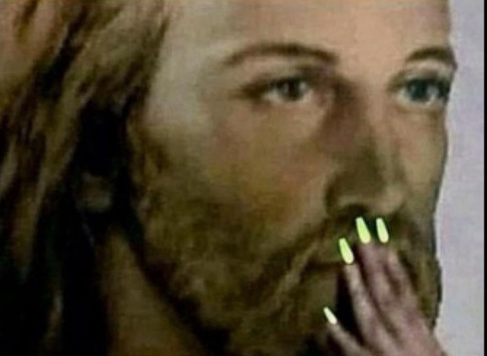 Closeup of a Jesus face pretending to be shocked using a comically miniature lady hand.