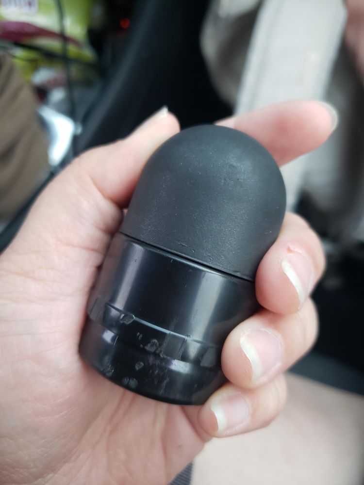 a photo of a hand holding a rubber bullet. It is the size of their palm