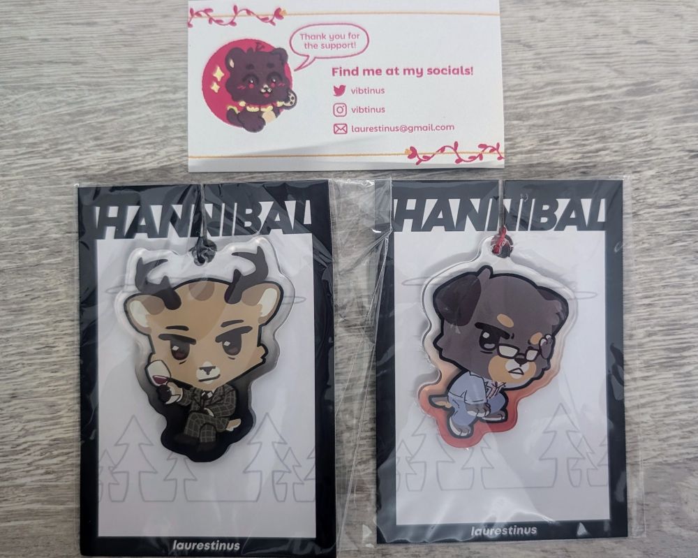 Adorable acrylic keychains of Hannibal Lecter as a chibi deer and Will Graham as a chibi puppy, made by Vibtinus / Laurestinus