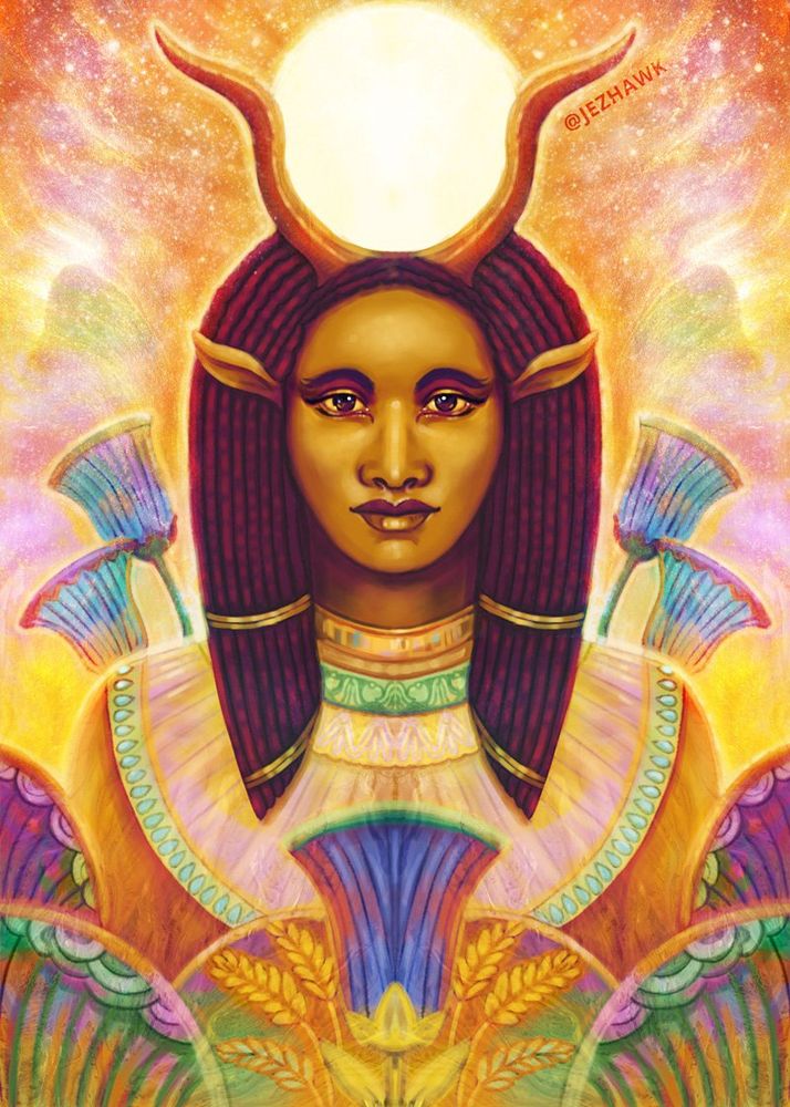 Hathor - From The Divine Masters Oracle she has blue lotus flowers around her and is surrounded by a soft glowing light. 