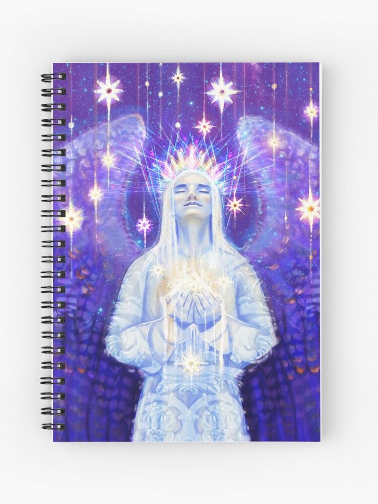 Manifestation spiral bound notebook, a beautiful pale blue angel is shown holding a shimmering pile of glowing energy, glittering stars rain down from above, the angel wears a shimmering crown and its purple wings are spread behind it. 