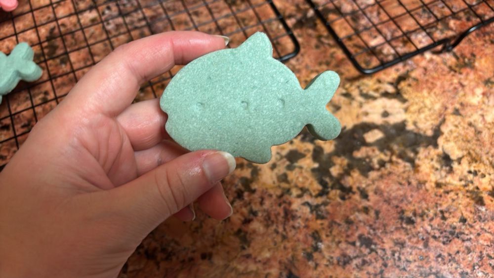 a blue shortbread cookie in the shape of a fish