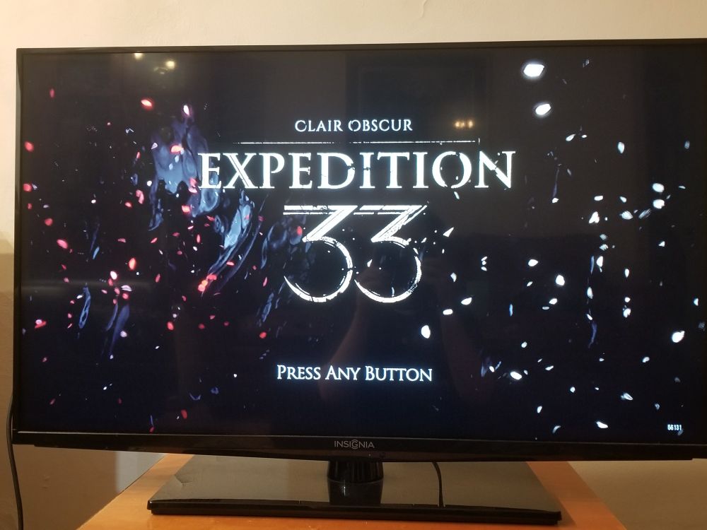 A TV with the title screen of "Expedition 33".