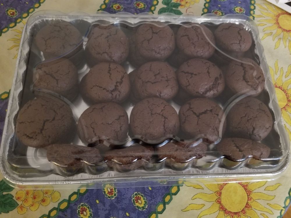 A container of chocolate cookies.
