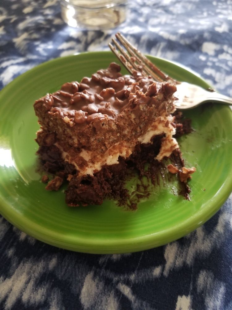 A dessert that's one later chocolate rice-crispie treat, one layer marshmallow, and one layer brownie.