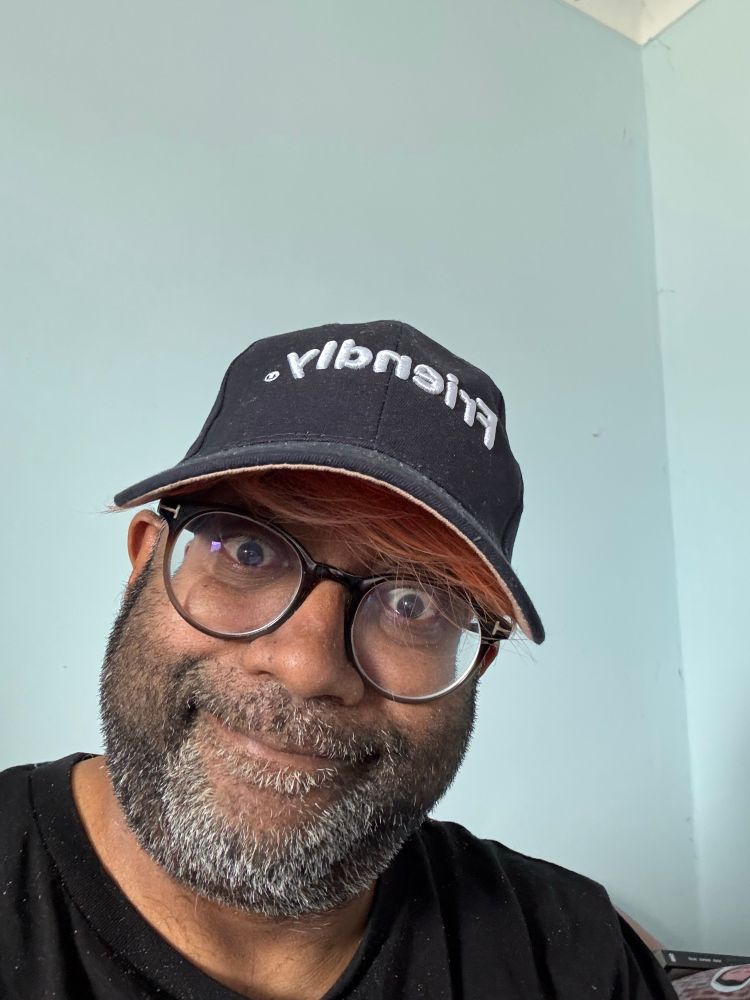 My unshaven face smiling but wearing an umbraco friendly hat 
