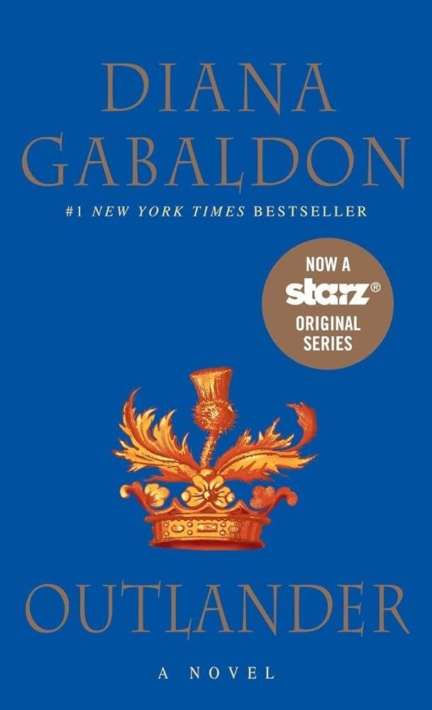Image of the cover of the book Outlander by Diana Gabaldon. It has a blue background with gold lettering. It features a gold image of a crown with a thistle growing out of the top. 