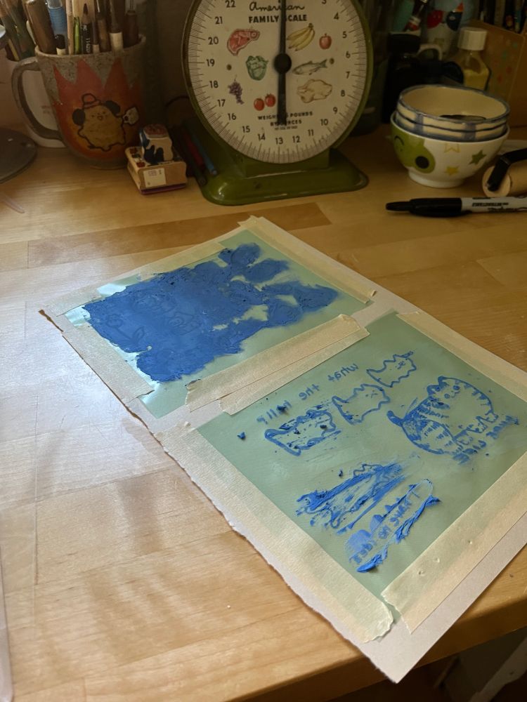 spreading underglaze on the screens
