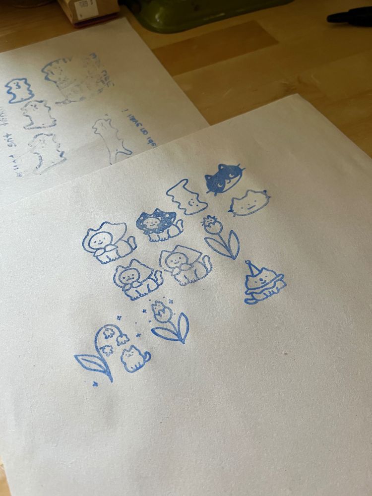 the screen printed underglaze designs on newsprint